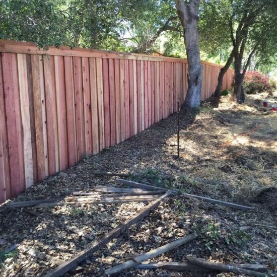 Wood privacy fence installation