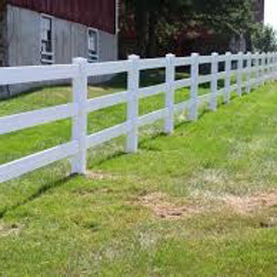White rail fence installation lawn