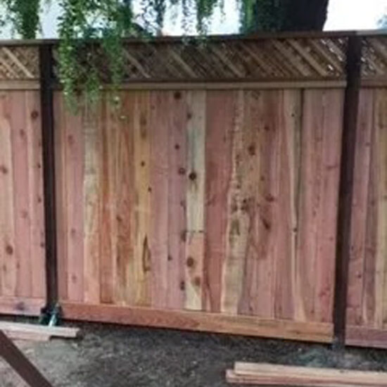 Wood privacy fence installation scene