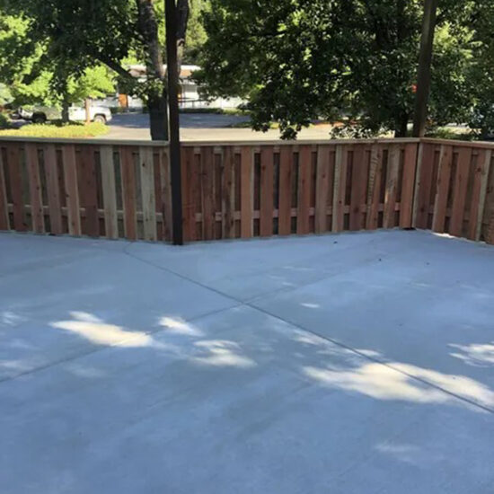Backyard wooden fence installation
