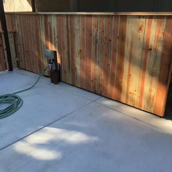 New wooden fence installation backyard