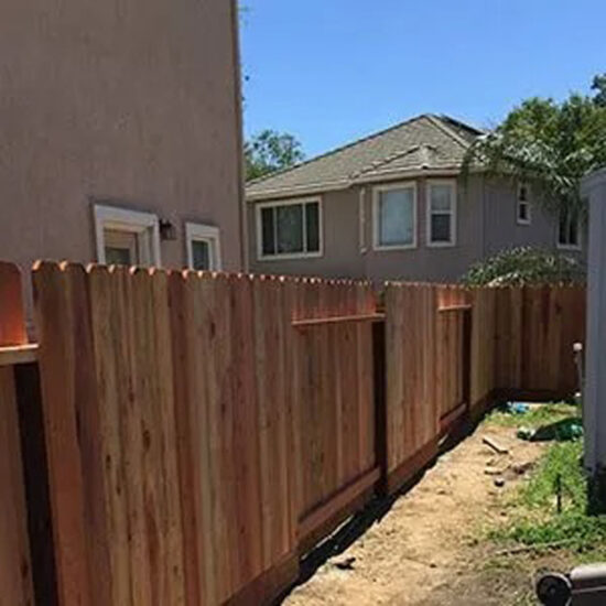 Wood privacy fence installation