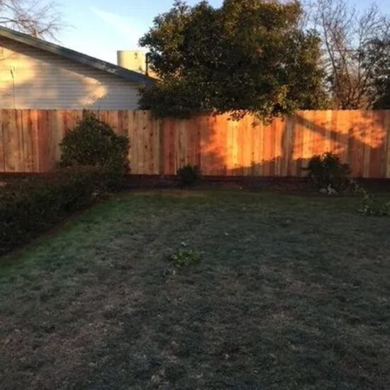 Wood privacy fence installation backyard