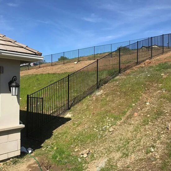 Wrought iron fence on slope