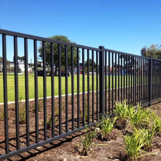 Black metal fence installation outdoors