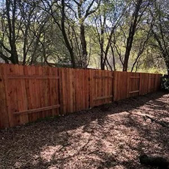 Wood privacy fence installation backyard
